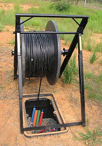 C Reel Payout Frame in use supporting a Corning FlexNet™ cable drum